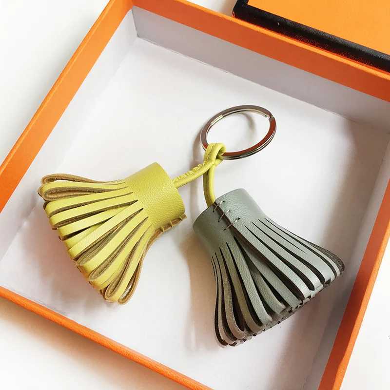 2025 New Luxury Genuine Leather Sheepskin Two-Color Grass Skirt Bag Pendant Key Ring Mens Handbag Tassel Hanging Decoration Y250815