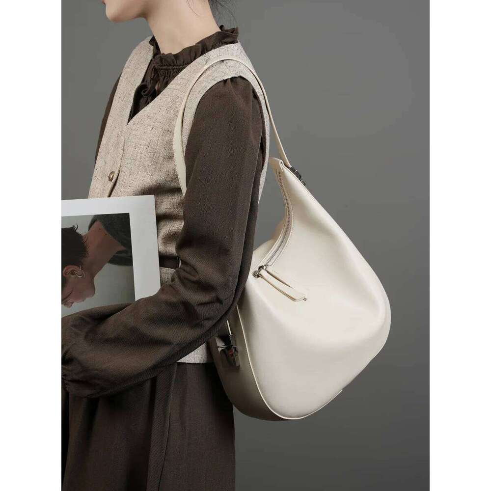 Designer Bags 2025 Spring/Summer New Niche Design Cowhide Underarm Shoulder Hand-Held Leather Crescent Bucket Women's Bag Luxury Bag
