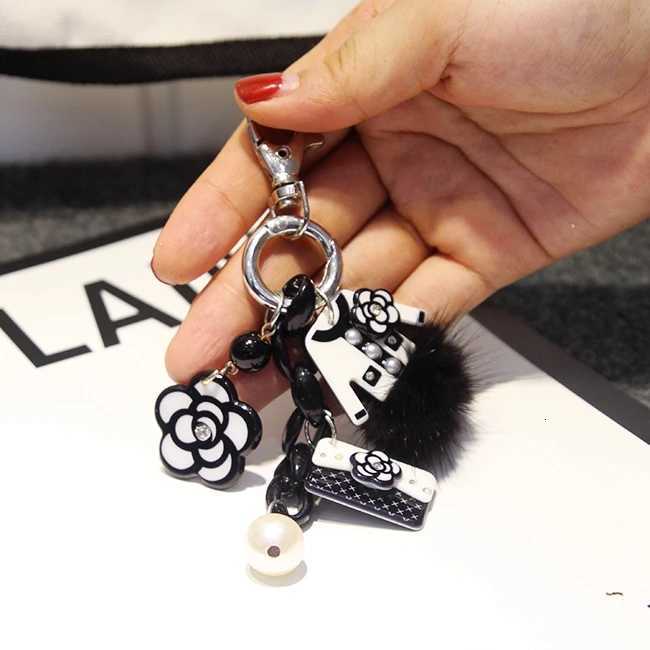 Elegant Luxury lia Flower Bowknot Purse Fur Ball Pearl Keychain For Girl Wen Key Chains Ring Car Bag Pendent Charm D378 S250816