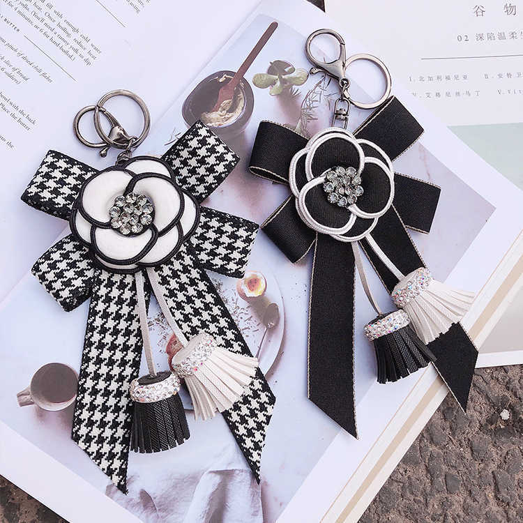 Korean style bow camellia tassel keychain diamond-encrusted bag pendant car key ring car decoration Z250816