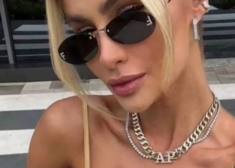 Elliptical frame sunglasses new fashion personality glasses featuring F letter dot diamond sunglasses