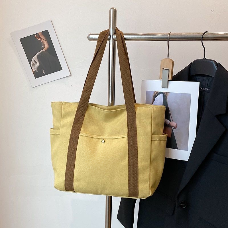 2025 Autumn Large Capacity Canvas Handbag Commuting Literature Student Backpack Women's Crossbody Bag Designer Bag Women's Shoulder Bag Dail