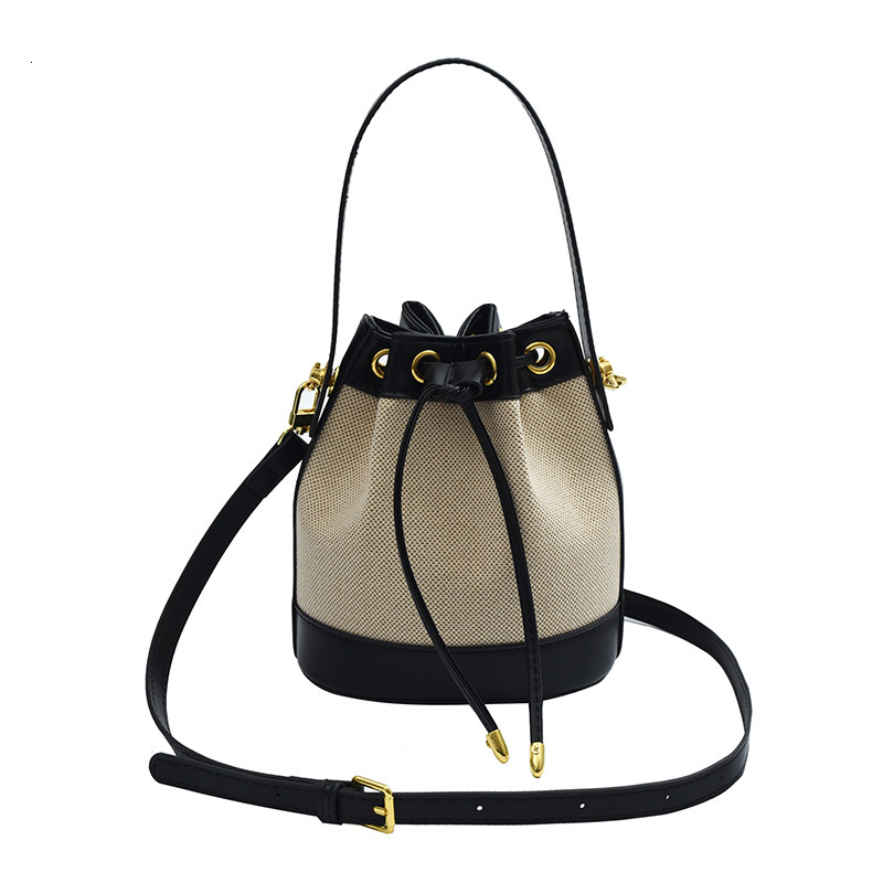 Free shipping designer Straw Woven Women Bag Summer New Niche Design Fashion Retro Rattan Drawstring Bucket Bag Versatile Crossbody Bag