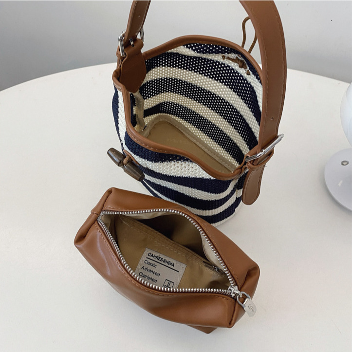 Free Shipping Designer Lazy Style Fashion Striped Women's Woven Bag Luxury New Single Shoulder Armpit Bag Leisure Vacation Hollow Beach Bag