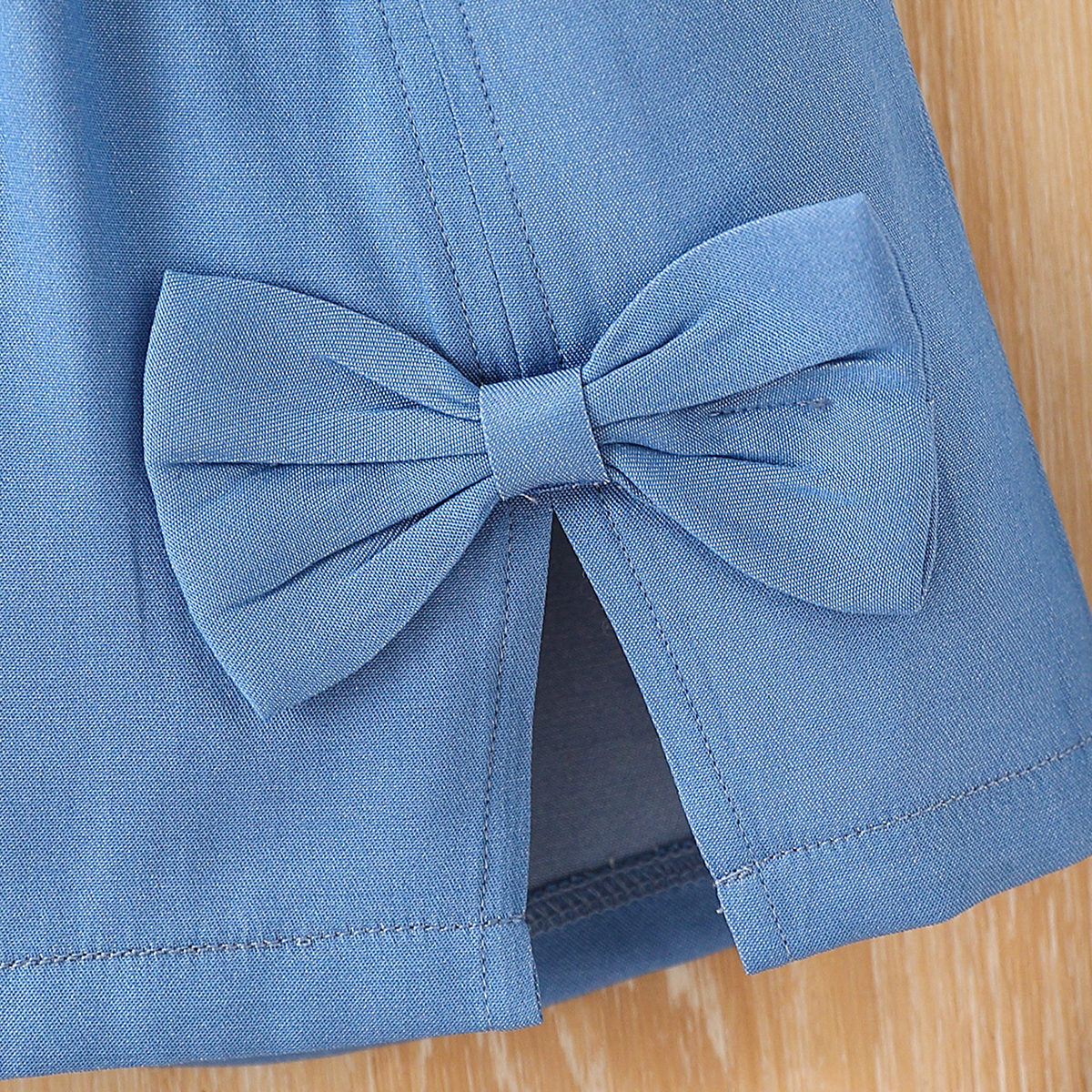 2-piece set of girls' fashionable casual bow print round neck pleated bubble long sleeved top and slit three-dimensional bow decoration short ski