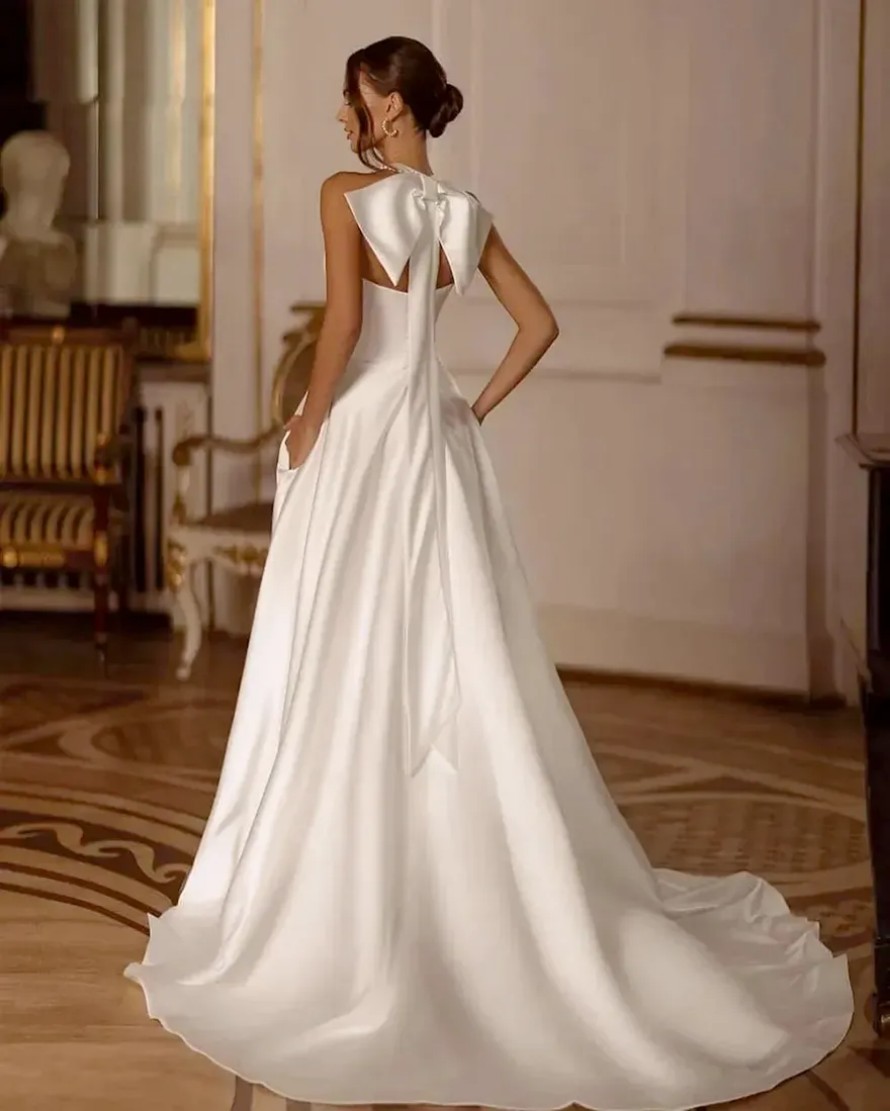 2025 A Line Satin Wedding Dresses Halter Neck Bow Sexy Pearls Side Split Bridal Gowns Custom Made Vestidos De Novia