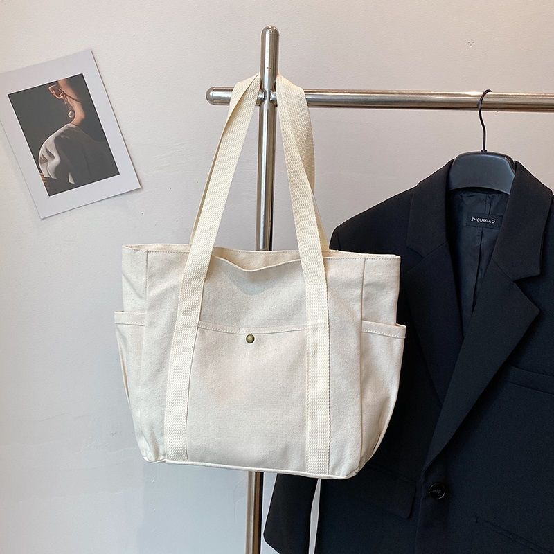 2025 Autumn Large Capacity Canvas Handbag Commuting Literature Student Backpack Women's Crossbody Bag Designer Bag Women's Shoulder Bag Dail