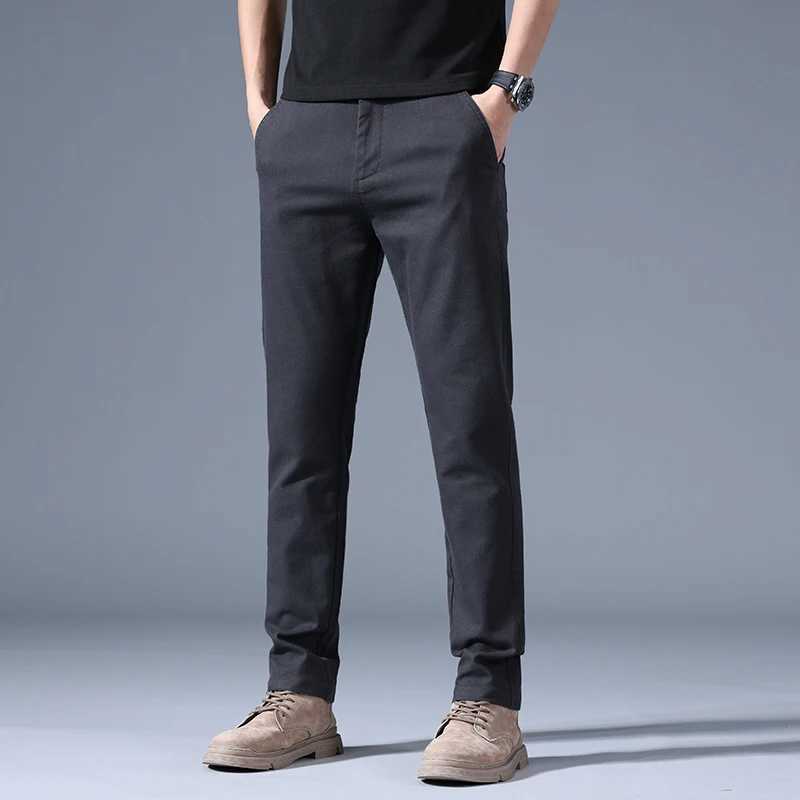 Mens Spring Autumn New Splicing Elasticized Button Zipper Pocket Fashion Solid Slim Straight Pants Korean Business Casual Pants W250819