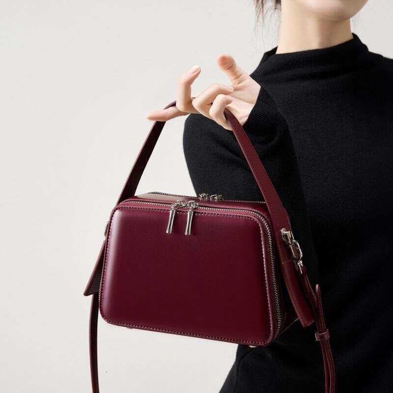 25 Spring Summer New Niche Design Ear-Hanging Series Handheld Brim Genuine Leather Women's Commuter Crossbody Bag
