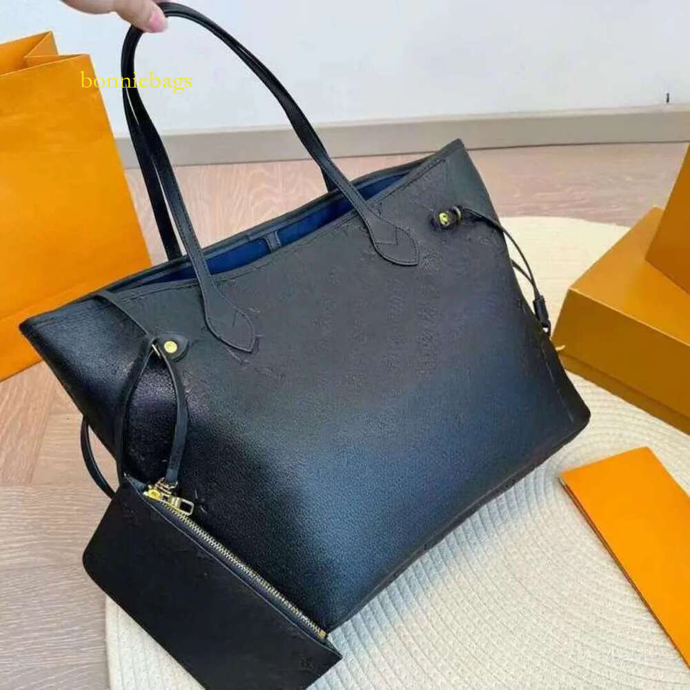 Designer Tote Classic Shopping Fashion Commuting Bag 31cm inside zipper wallet in Empreinte Calfskin with plated hardware