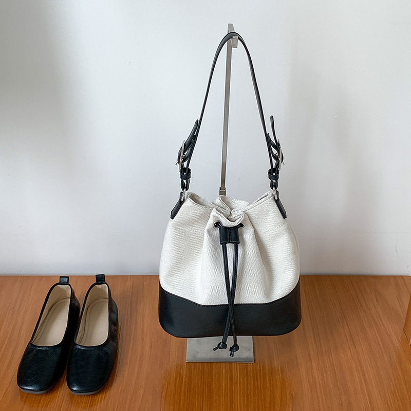 Free shipping designer 2025 New Korean Drawstring Patchwork Single Shoulder Bag for Women Niche Fashion Large Capacity Commuter Bag Chain Bag Bucket B