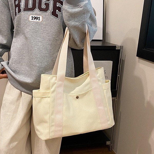 2025 Autumn Large Capacity Canvas Handbag Commuting Literature Student Backpack Women's Crossbody Bag Designer Bag Women's Shoulder Bag Dail