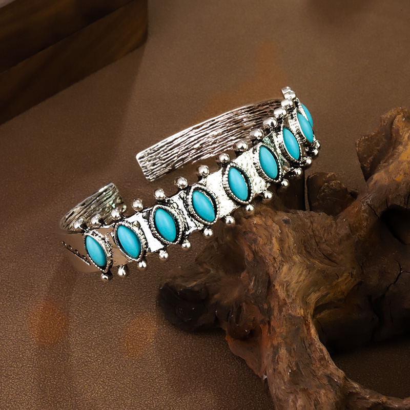 Artisan Tribal Cuff Bracelet Hand Stamped Turquoise Accent Bangle with Feather Motifs Adjustable Closure
