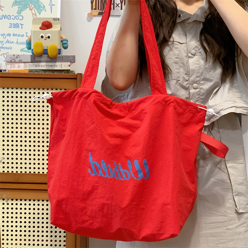 2025 Autumn Women's Casual Handbag Drawstring Canvas Bag Commuter Lightweight Handbag Large Capacity Shoulder Bag Women's Crossbody Bag Desi