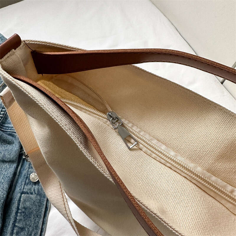 Canvas women with large capacity and niche design, trendy texture handbag for commuting, college students, class,