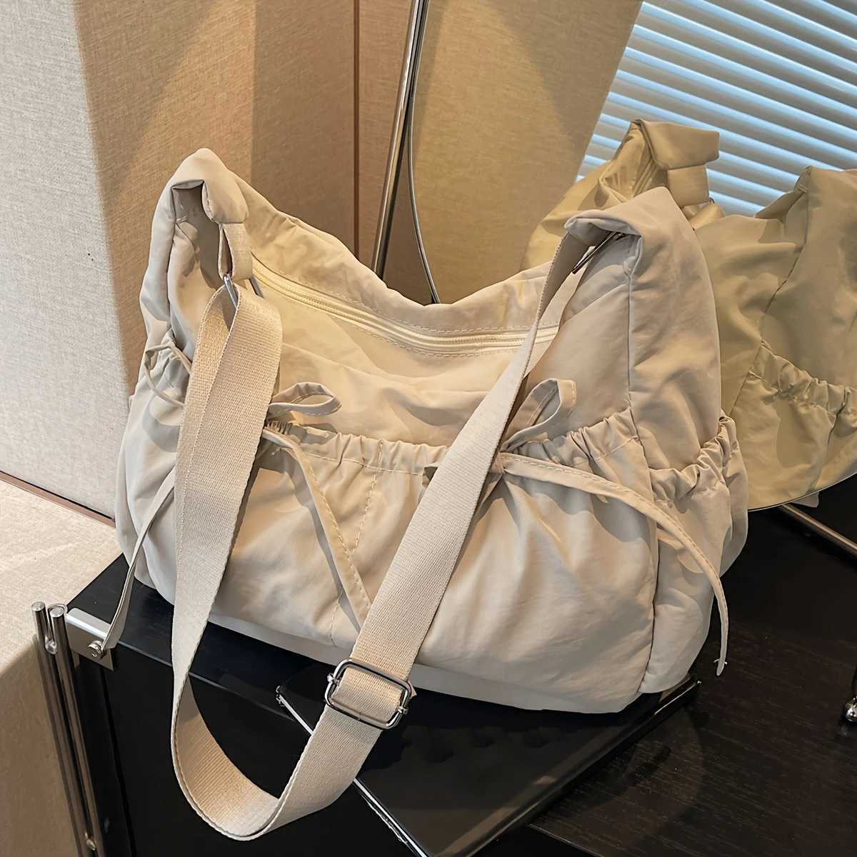 Casual simple and lightweight womens messenger bag niche pleated design bow tote bag large capacity Y250819