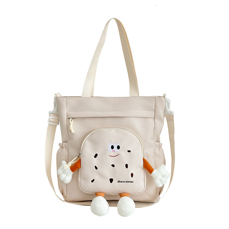 2025 Autumn Cute Canvas Bag Biscuit Biscuit Crossbody Bag Design Shiny Nylon Shoulder Bag Large Capacity Bag Women's Crossbody Bag Designer Bag W