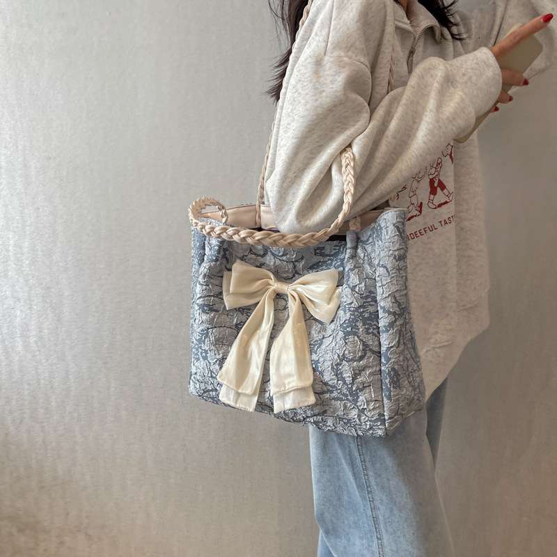 2025 autumn women's bag niche design knitted bow color blocked shoulder bag casual travel handbag handbag women's bag women's crossbody