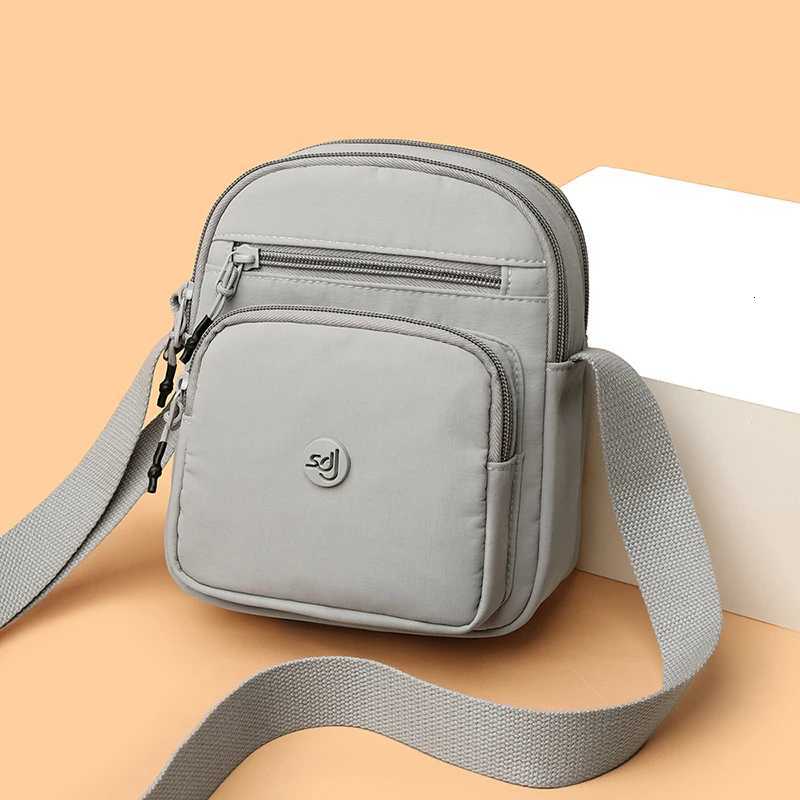 Minimalist Style Lightweight Drawstring Canvas Small Bag Versatile Mini Single-Shoulder Crossbody Coin Purse for Mobile Phones Y250819