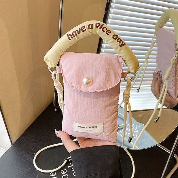 2025 autumn new minimalist style mobile phone storage bag Korean style women's slanted small bag handheld cloth bag women's mobile phone bag