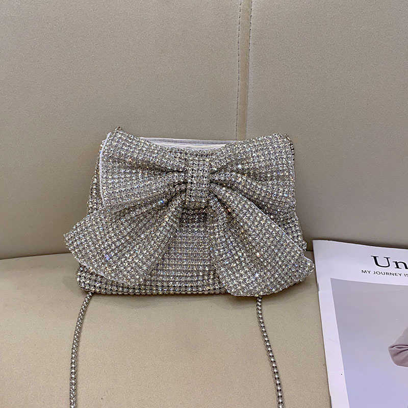 Fashionable, shiny, non functional, rhinestone, big bow, elegant and luxurious, ladies and socialites, evening party, hand-held crossbody bag