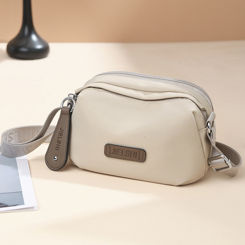 2025 Autumn New Women's Casual Shoulder Bag Japanese Style Fashion Solid Color Oxford Cloth Waterproof Simple Fashion Crossbody Bag Women's 