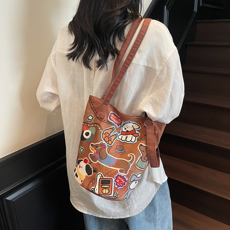 2025 Autumn Cute Dog Printed Commuter Bag Leisure Cute Fashion Bucket Bag Large Capacity Shoulder Bag Art Fashion Canvas Bag Women's Crossbody Ba