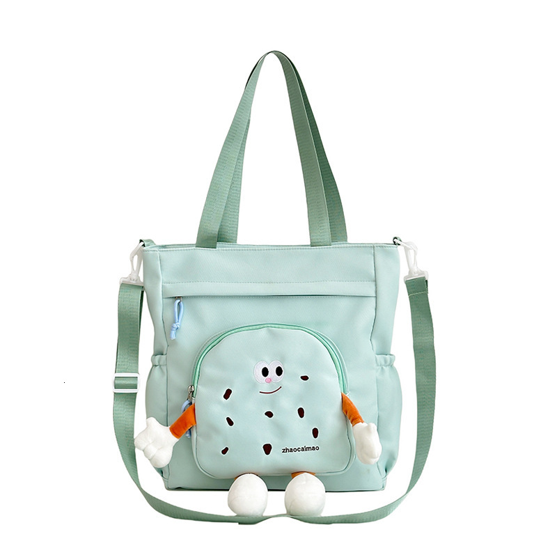 2025 Autumn Cute Canvas Bag Biscuit Biscuit Crossbody Bag Design Shiny Nylon Shoulder Bag Large Capacity Bag Women's Crossbody Bag Designer Bag W