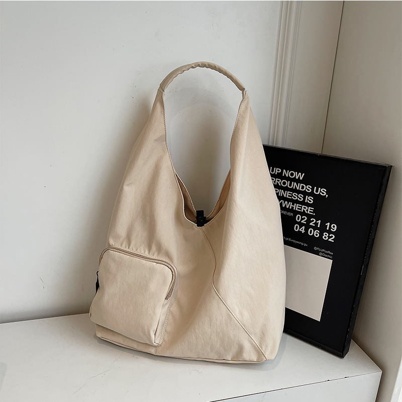 2025 Autumn Japanese style unprinted shoulder bag triangle bag large capacity crossbody bag commuting handbag women's canvas bag women's cro