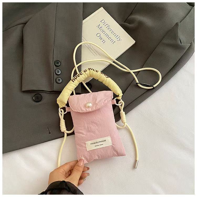 2025 autumn new minimalist style mobile phone storage bag Korean style women's slanted small bag handheld cloth bag women's mobile phone bag