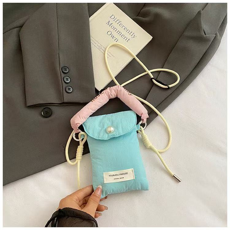 2025 autumn new minimalist style mobile phone storage bag Korean style women's slanted small bag handheld cloth bag women's mobile phone bag