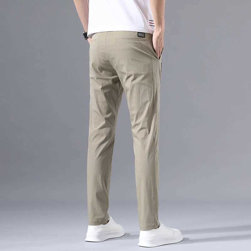 2025 Mens Casual Pants Slim Fit Stretch Classic Chino Trousers Male Stretch Elastic Korean Summer Dress Ice Light Thin Business XJ250821