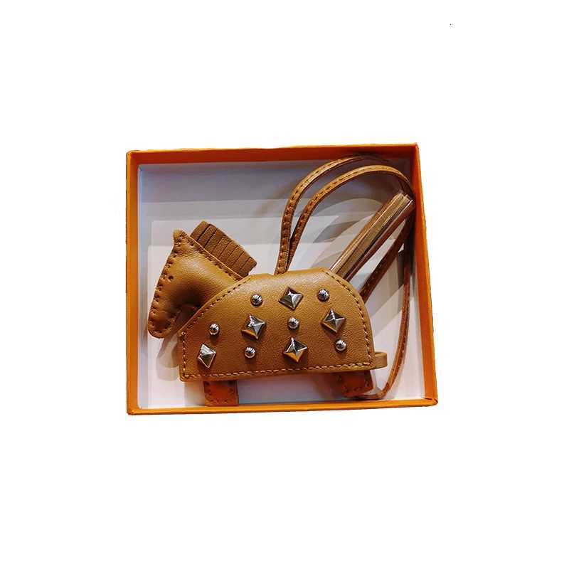 Soft Leather Pony Pendant Car Pendant Key designer Pendant Handmade Leather New Rivets War Horse Bag Charm Bag Charm Leather XJ250822