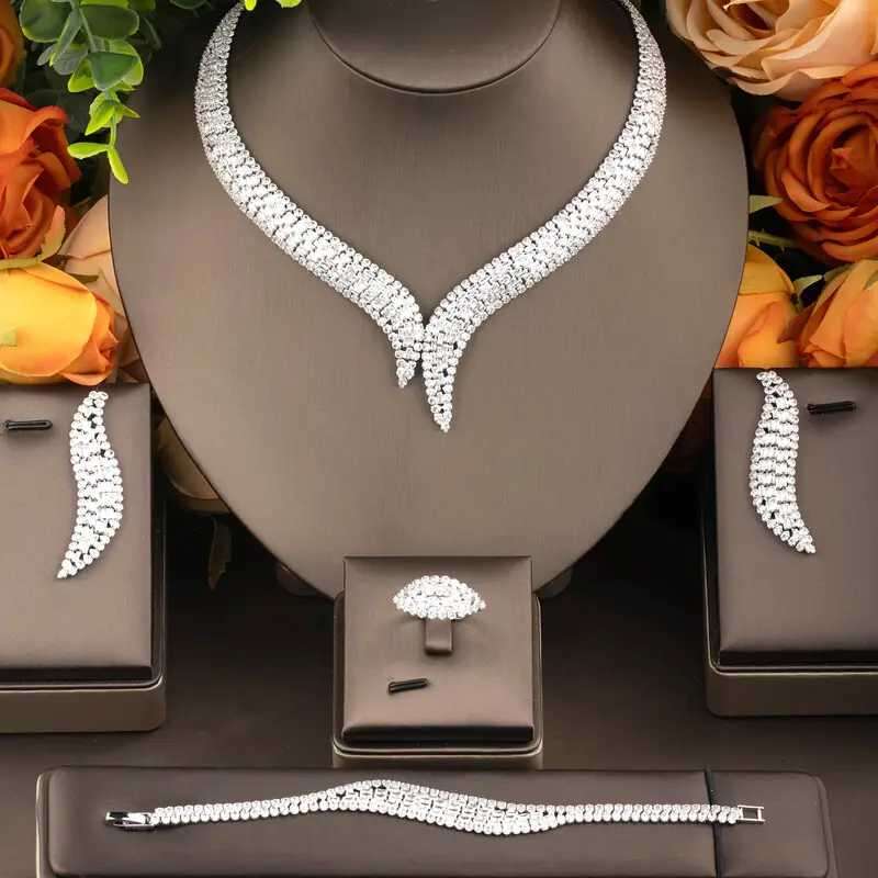 A set of jewelry studded Luxury Chain Necklaces Set Women Pendant Necklace Diamond Stud Earrings Charm Bracelet Jewlery Sets for Party Wedding Anniver