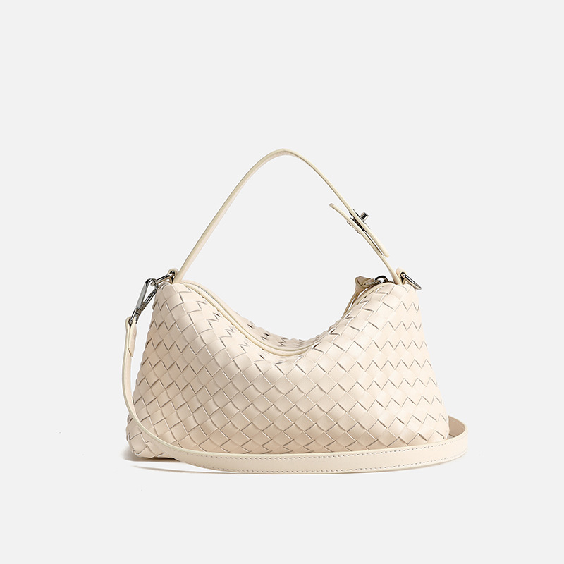 this year New niche hand-woven bag with large capacity shoulder and crossbody baguette bag and comes with a pendant