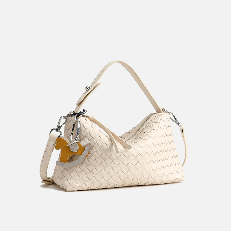 this year New niche hand-woven bag with large capacity shoulder and crossbody baguette bag and comes with a pendant