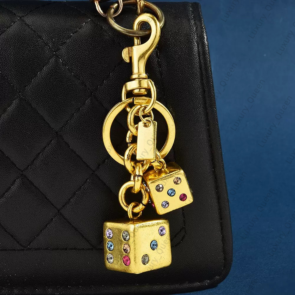 Designer bag charm dice dinosaur charm Keychain Feather Star Keyring Hangings key chain women Lanyards Co ch Keychains handbag Lanyards