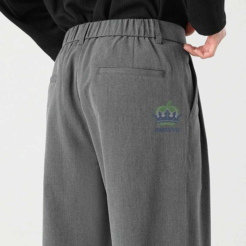ousyu Brand Luxury Quality Baggy Casual Pants Men Business Elastic Waist Korean Black Work Formal Trousers Male Plus Size S4xl W250826