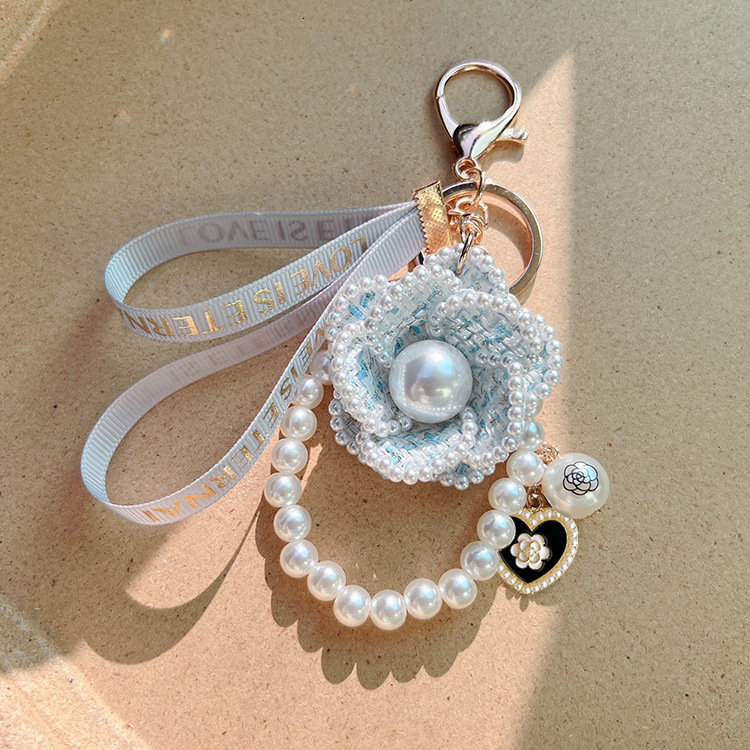 designer jewelry Korean Version Pearl Element Camellia Keychain Bag Pendant Creative Self-Designed Model Factory Supply