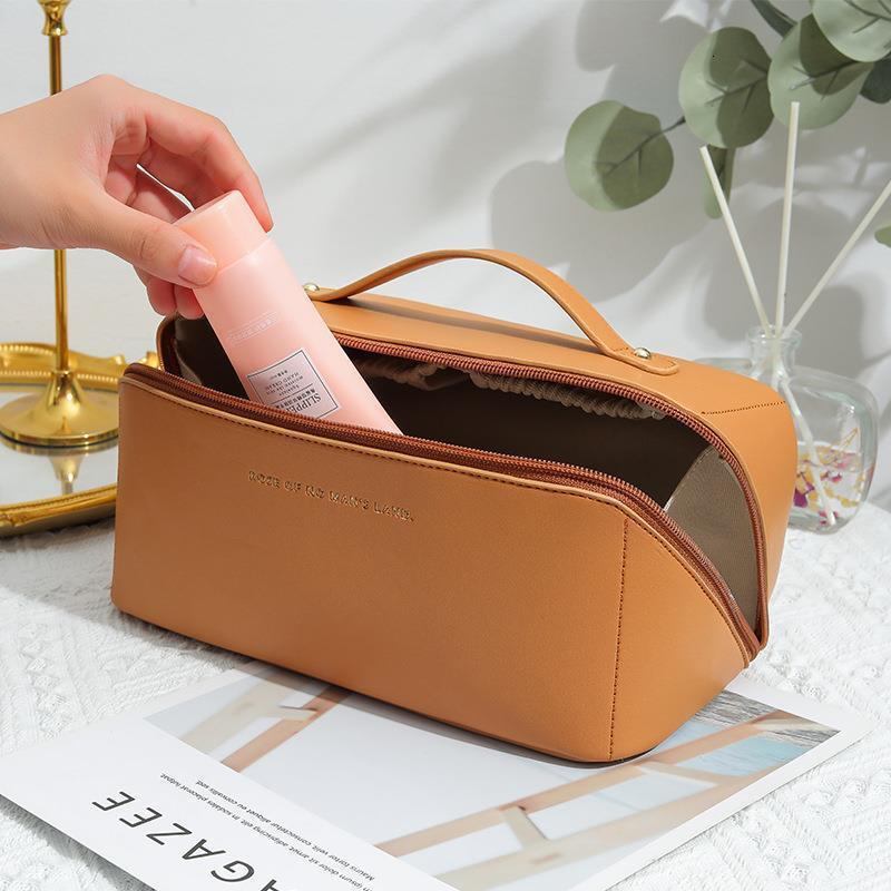 2025 Autumn New Makeup Bag Lightweight Women s Large Capacity Simple Portable bag elegant Bag Travel Supplies Storage Designer Handbag
