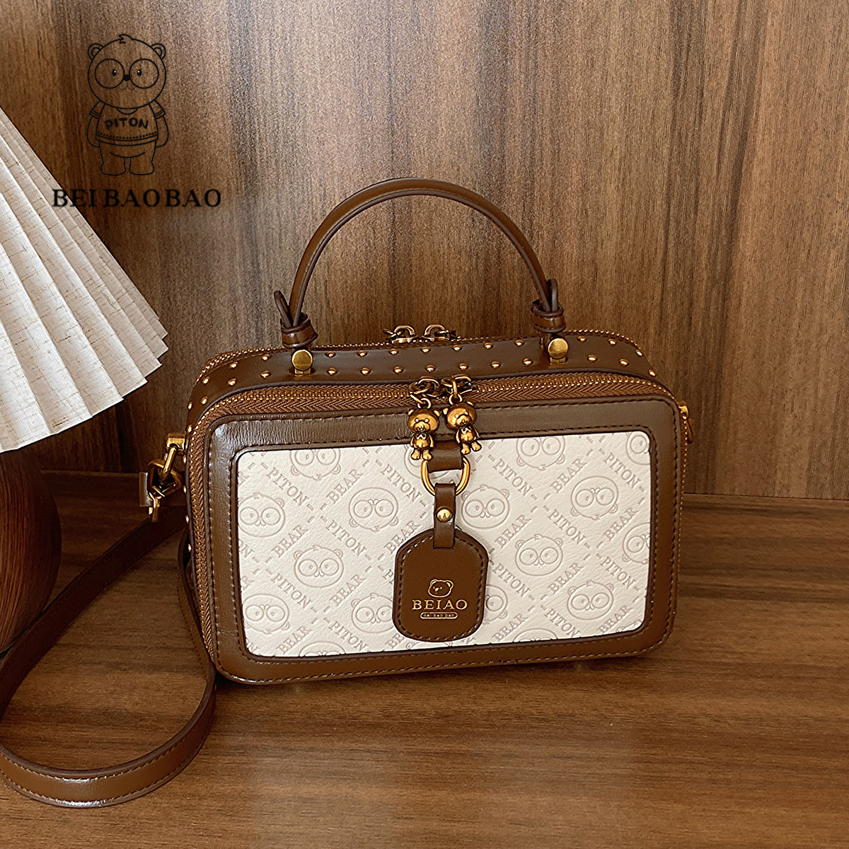 This small square box bag is a niche design for women versatile embossed and can be carried diagonally on one shoulder with a high-end feel