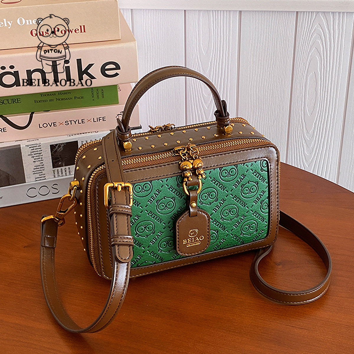This small square box bag is a niche design for women versatile embossed and can be carried diagonally on one shoulder with a high-end feel