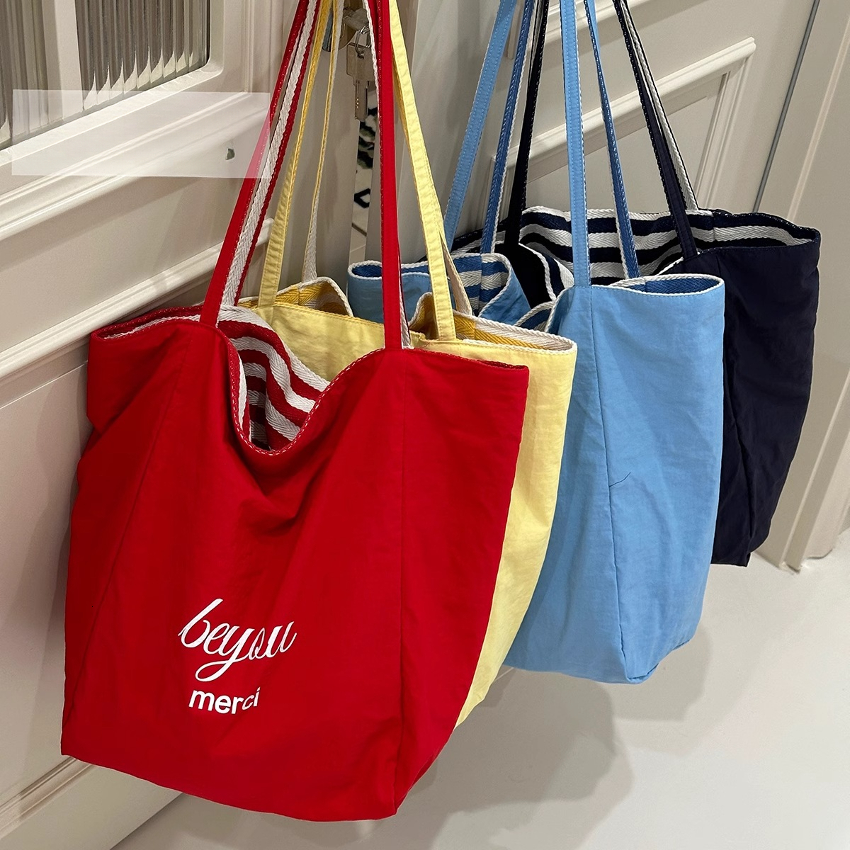 2025 autumn new casual lightweight striped double-sided usable simple niche commuting canvas handbag designer canvas bag bag women's shoulder bag