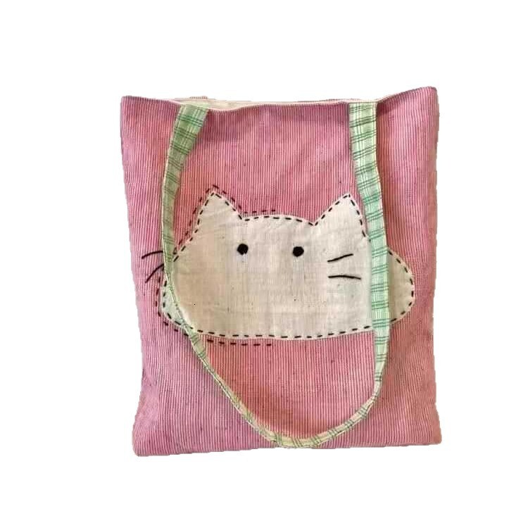 2025 autumn new Japanese style shoulder bag lightweight, niche, simple canvas women's bag cute cartoon bag cat head pink shoulder bag designer ca