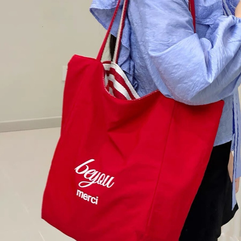 2025 autumn new striped canvas bag bag, Korean version handbag, casual, simple, niche, lightweight, large capacity, available with designer shoulder b