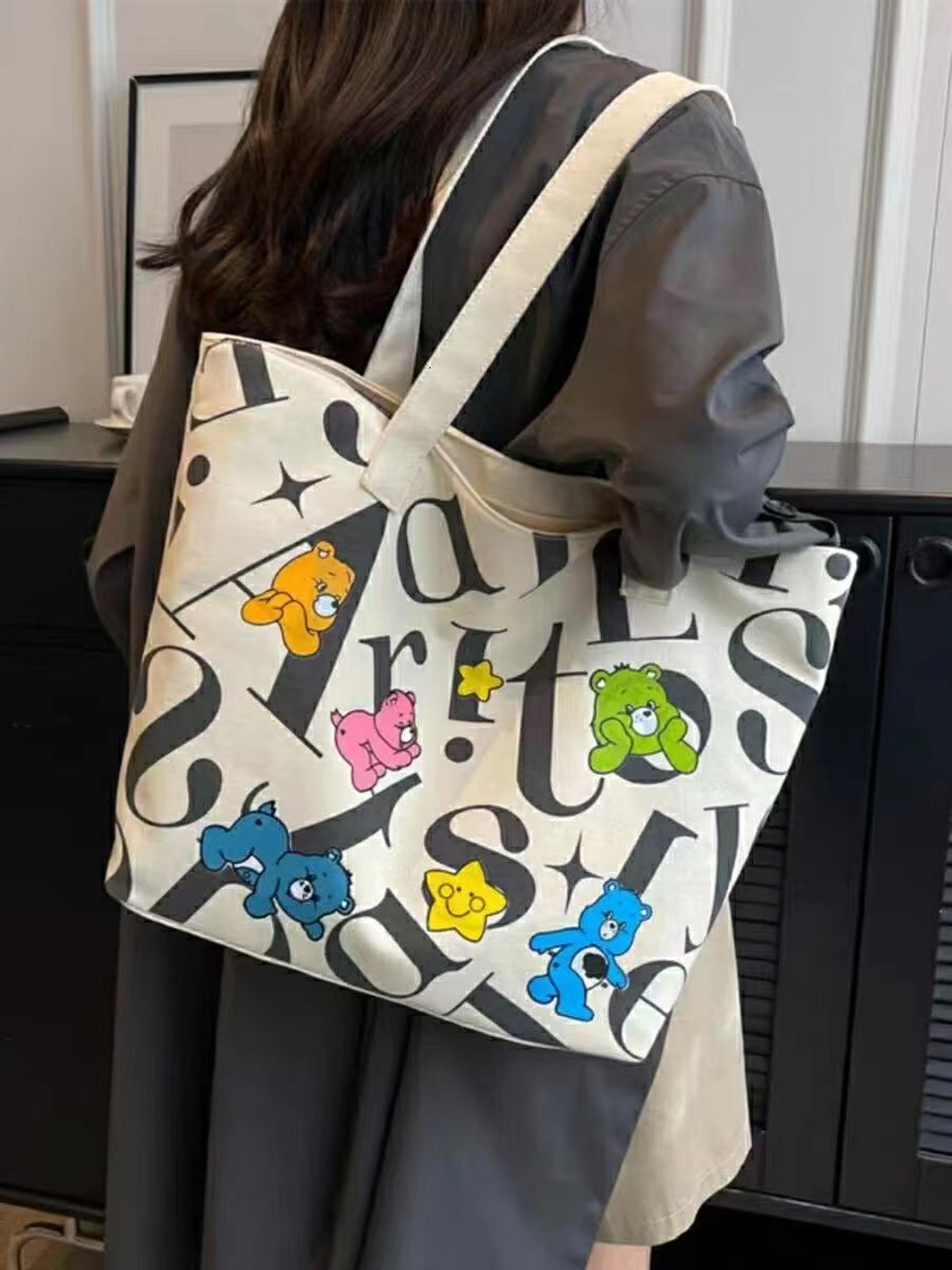 2025 autumn new student canvas bag, lightweight bag and large capacity handbag, simple and niche commuter casual handbag, designer shoulder bag