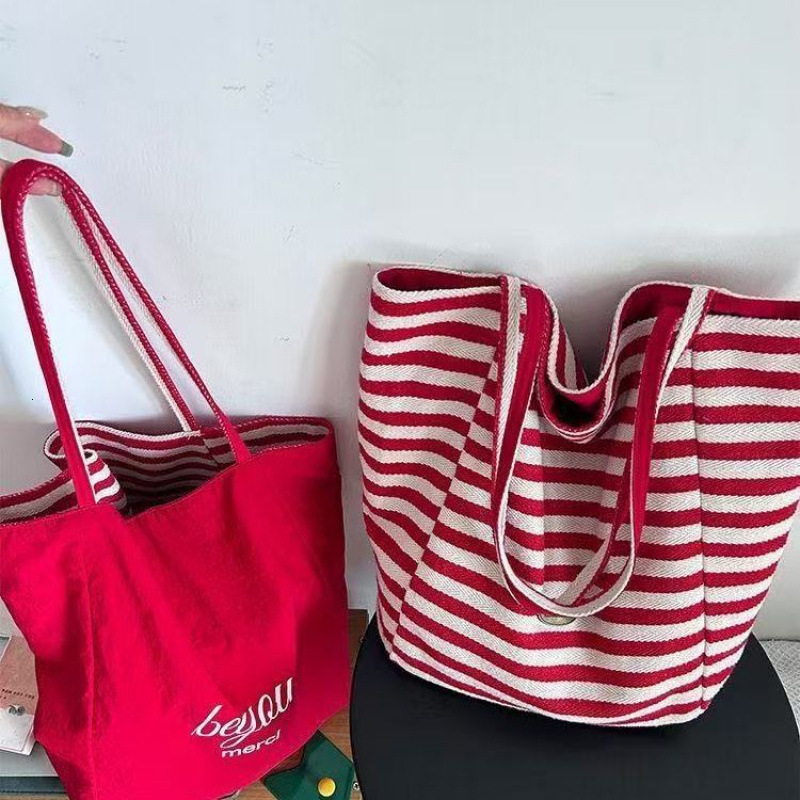 2025 autumn new double-sided striped canvas bag bag niche simple Korean style double-sided usable lazy style handbag designer shoulder bag women'