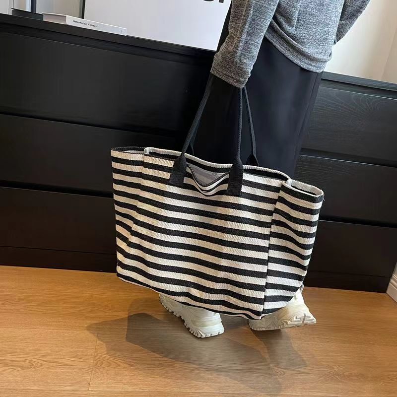 2025 autumn new canvas bag, fashionable commuting bag, simple and niche design, women's large bag capacity handbag, striped designer shoulder bag