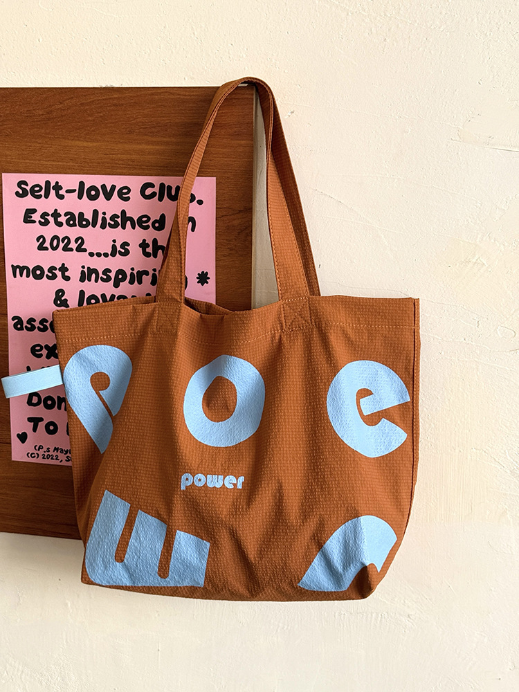 2025 Autumn New Korean Letter Drawstring Design Simple, Small, bag Lightweight, Large Capacity Casual Shoulder Designer Shoulder Bag Women's Canv