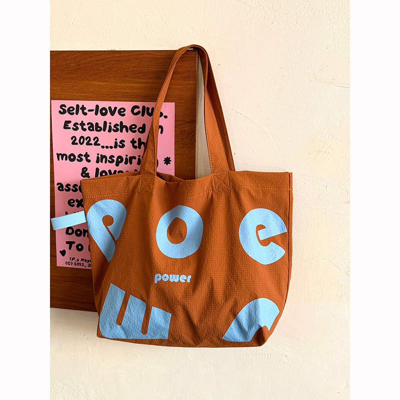 2025 Autumn New Korean Letter Drawstring Design Simple, Small, bag Lightweight, Large Capacity Casual Shoulder Designer Shoulder Bag Women's Canv